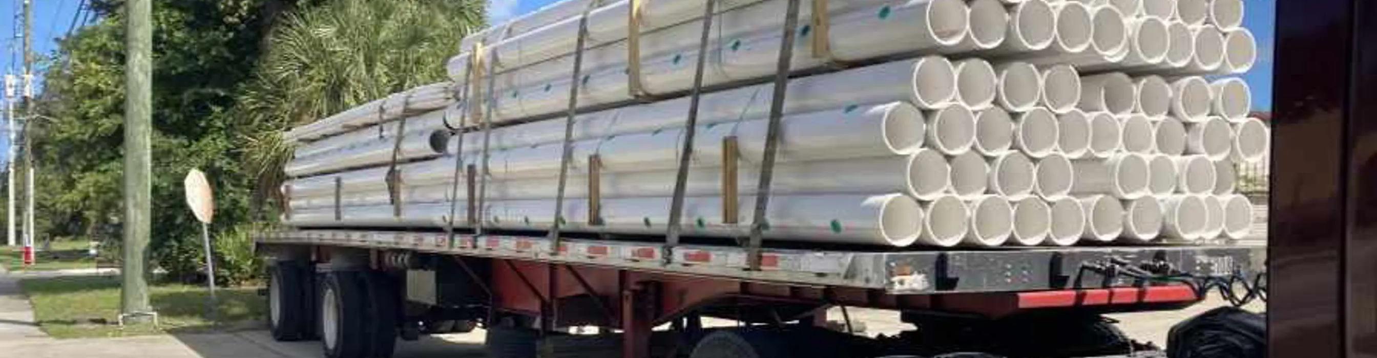 A truck delivering accessories and pipe for a Holland Pump system
