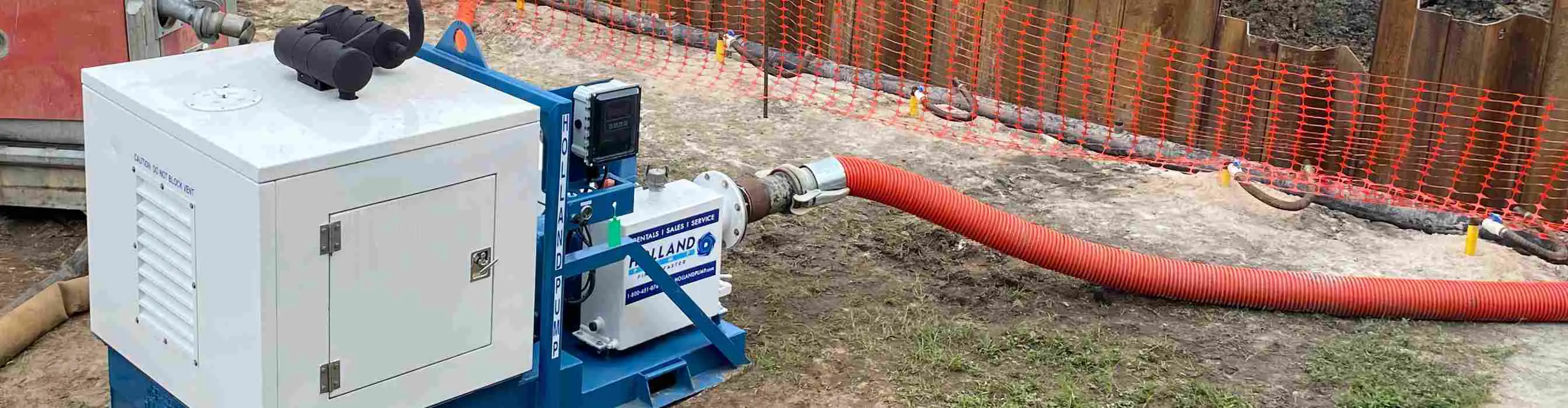 Engine-enclosed wellpoint pump connected to a wellpoint system, drawing down the water for sewer pipe connection