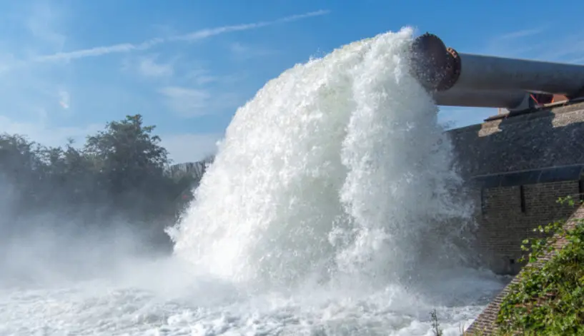 A pipe with water flowing out of it at a Vanderkamp project