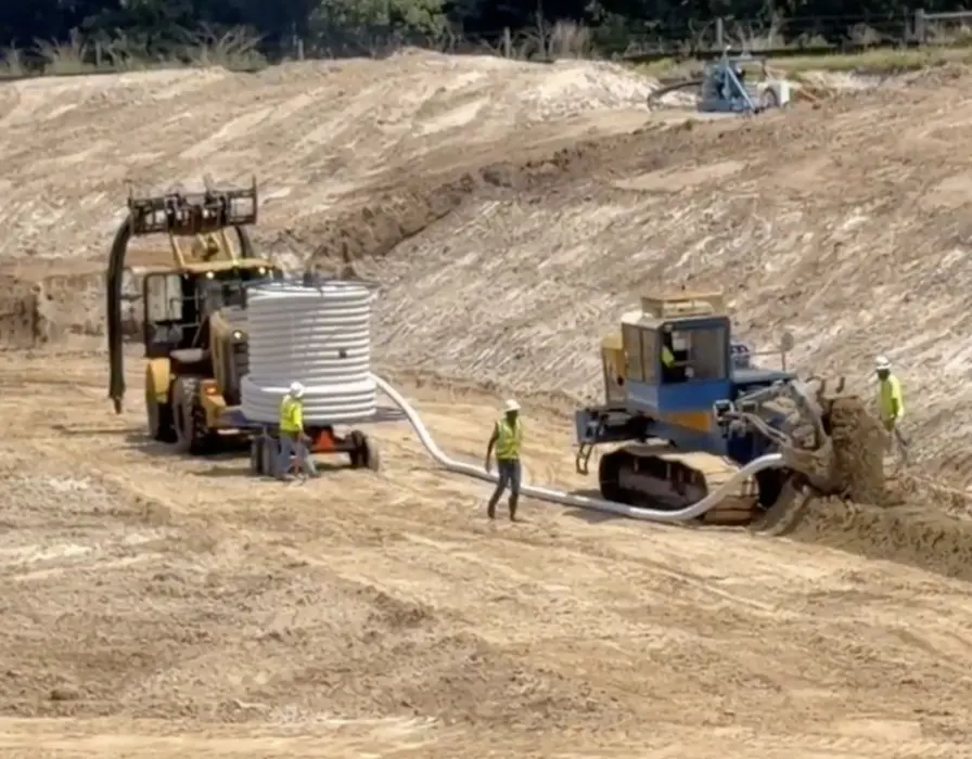 Holland Pump Sock Dewatering Trencher on site