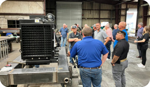 Holland Pump employees looking at a pump in their depot