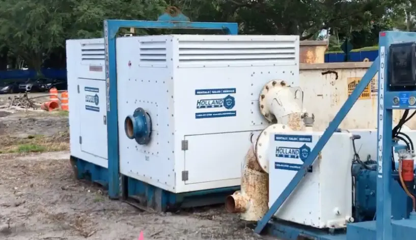 A high-powered 'Holland Pump' pump being used in a sock dewatering system