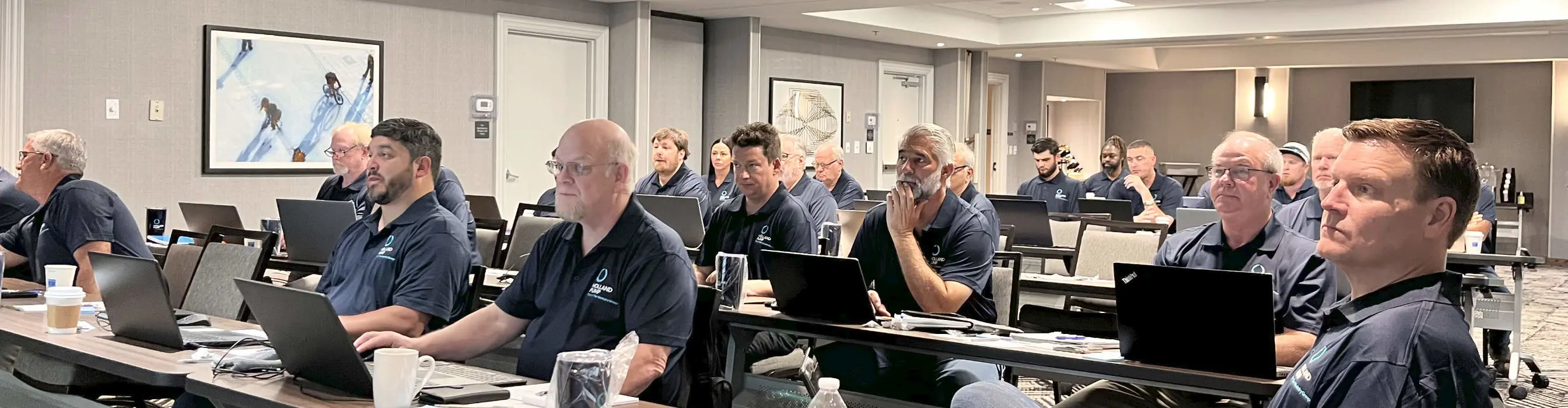 Holland Pump rental solutions team discussing ideas and reviewing projects