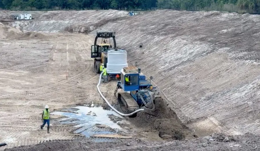 Holland Pump sock dewatering system with four of the installation team on site
