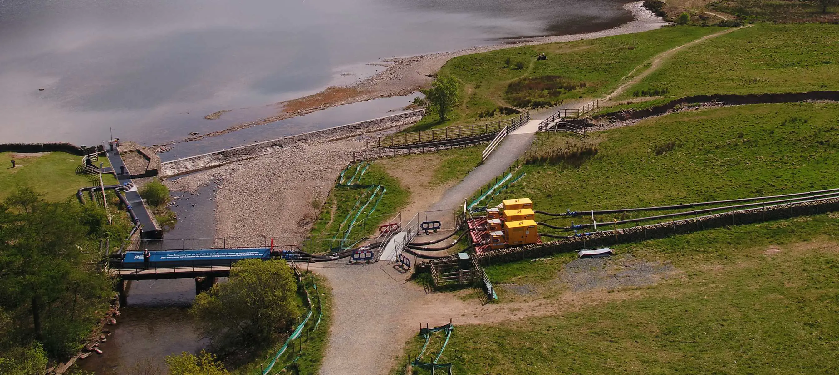 Three Selwood pumps on hire at a reservoir in the Lake District